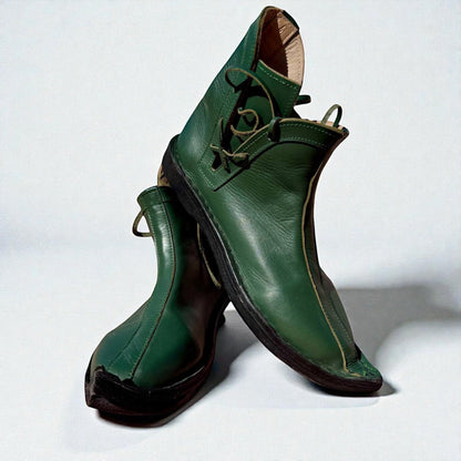 Handmade green medieval leather boots with wrap laces and full-grain texture, ideal for LARP or Renaissance faire